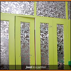 Floral ACP (Aluminium Composite Panel) Jaalis sandwiched between 2 glasses for a partition